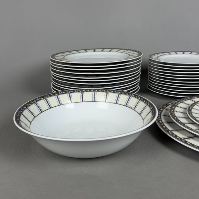 Refined and prestigious complete dinner service for 12 in fine white porcelain, designed by the renowned Parisian maison...