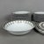 Refined and prestigious complete dinner service for 12 in fine white porcelain, designed by the renowned Parisian maison...