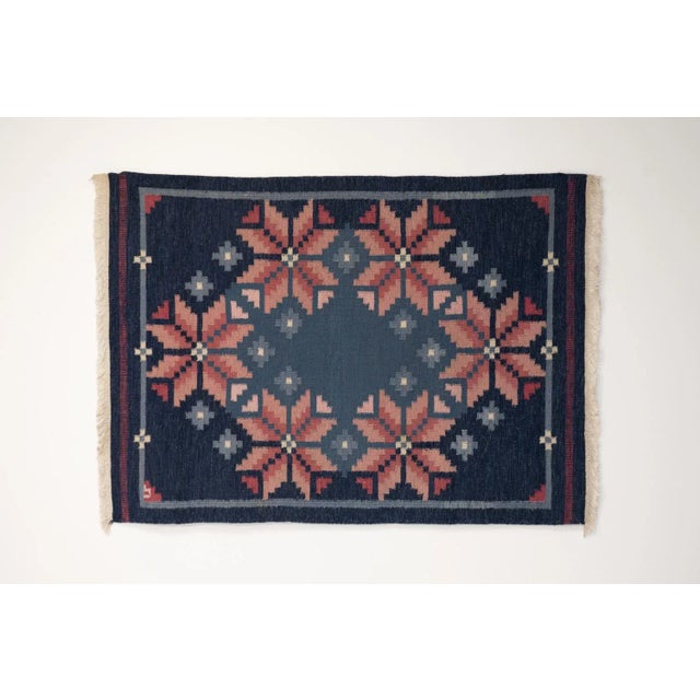 Mid-Century Swedish kilim in tones of blues and pinks in a geometric pattern. Professionally cleaned. Great condition....