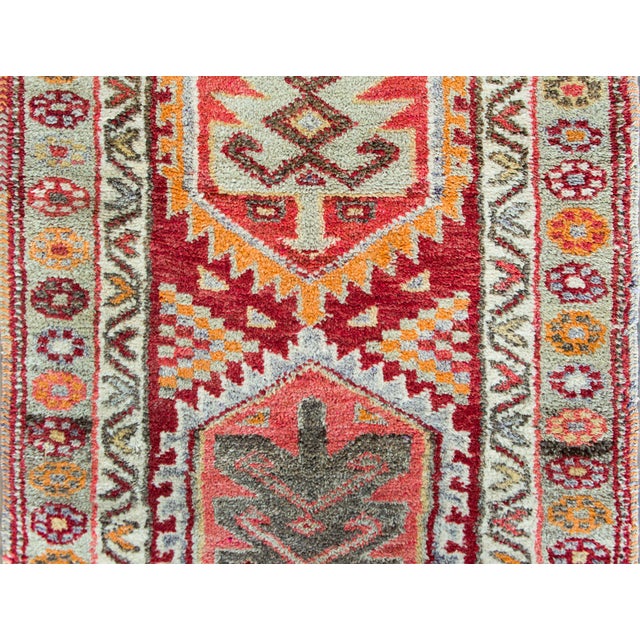 A gorgeous Mid-20th Century Turkish Konya runner with the best Large Scale stylized flowers and geometric shapes woven in...