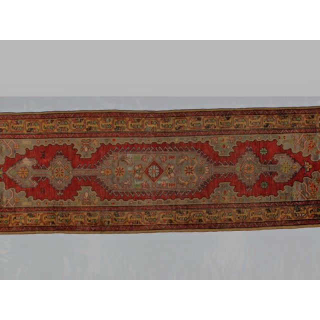 Wool pile genuine handwoven vintage Turkish vegetable dye Oushak runner. The piece is in excellent condition.