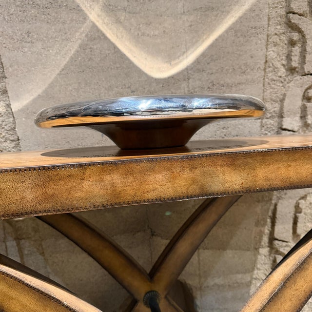 For your consideration, a large, highly-reflective, chrome or polished metal bowl.It is likely a decorative art piece or...