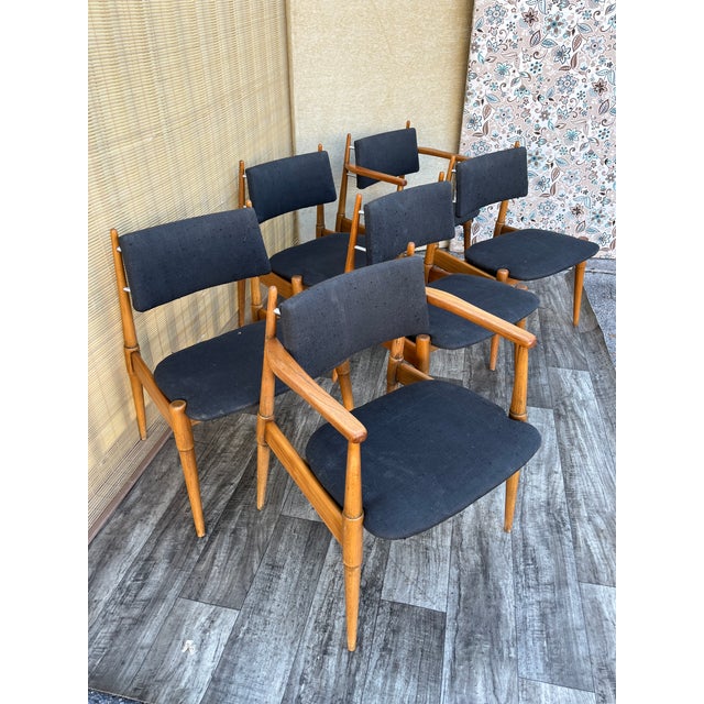 Set of Six Mid-Century Modern Atomic Era Dining Chairs Circa 1960s Features solid walnut frames with tapered legs and...
