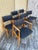 Set of Six Mid-Century Modern Atomic Era Dining Chairs Circa 1960s Features solid walnut frames with tapered legs and...
