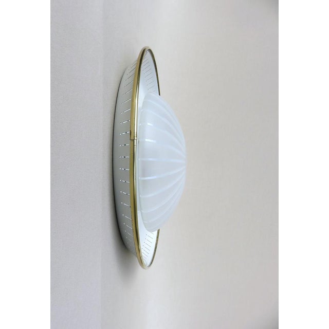 An elegant ceiling light manufactured by Hillebrand Leuchten in the 50s. Thanks to the lampshade made of satined and clear...