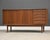 A mid century modern teak credenza with two sliding doors and five drawers. Beautiful Danish design similar to those of...