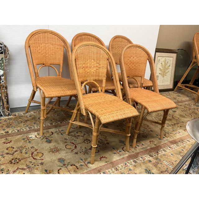 Design Plus Gallery presents a Set of Five Natural Sunwashed Rivera Rattan Dining Chairs from Serena & Lily. These chairs...