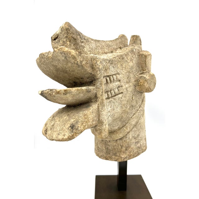 A stone Lasara head made by the Nias People of Indonesia. The Indonesian island of Nias has earned an international...