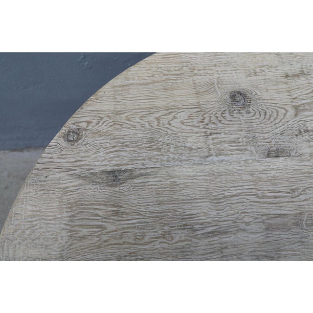 Reclaimed Pine top on an aged Iron Cone Shaped Base, the 2.5" thick top made from 100 year old beams. This makes a...