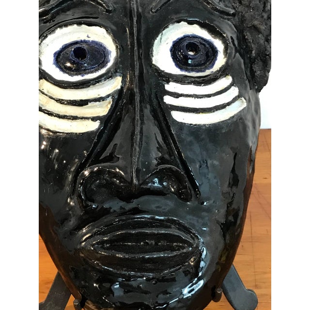 Mid-Century Pottery Exotic African Mask in the Style of Wiener Werkstatte A striking mid-century pottery work is an exotic...