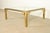 An exceptional mid-century modern Hollywood Regency coffee table or cocktail table By Mastercraft USA, 1970s Brass frame...