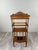 A charming wooden side table, resting on tapered and fluted legs, richly decorated with carved motifs in the Louis XVI...