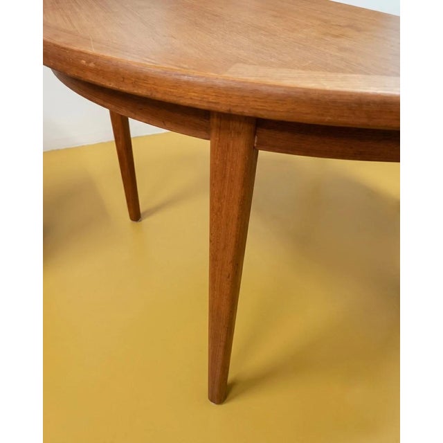 Vintage 1950s Danish teak dining table, circular top Ø110 cm, extendable with two extension leaves. Dimensions: Closed...