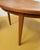 Vintage 1950s Danish teak dining table, circular top Ø110 cm, extendable with two extension leaves. Dimensions: Closed...