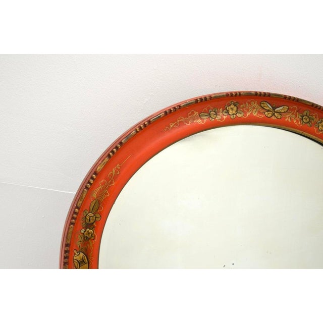 A charming antique lacquered chinoiserie mirror. This was made in England, it dates from around the 1920’s. It is a lovely...