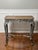 French Louis XV style painted table with a distressed finish, late 19th century. A painted, faux natural finish tabletop...