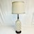Offering a stunning Mid-Century Tall Ceramic and Walnut Table Lamp. The ceramic body features a detailed geometric design...