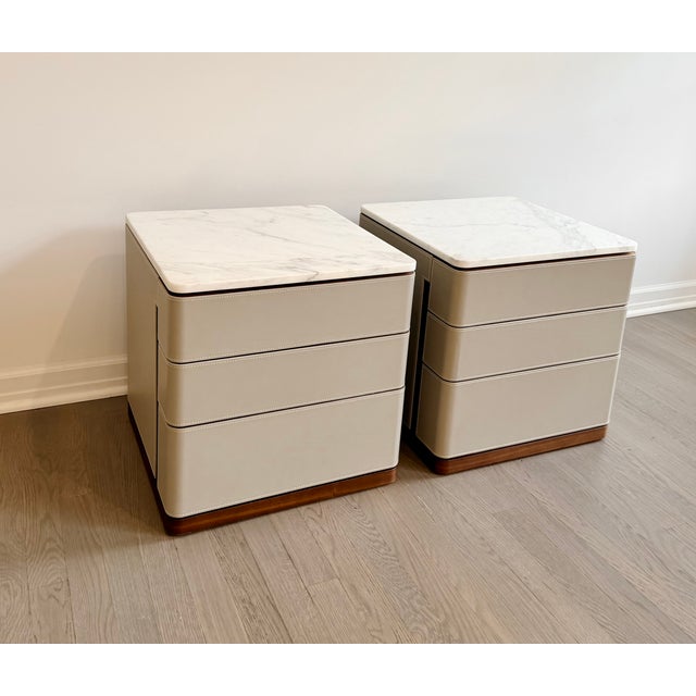 A striking pair of Fidelio Notte nightstands designed by Roberto Lazzeroni for Poltrona Frau, combining exceptional...