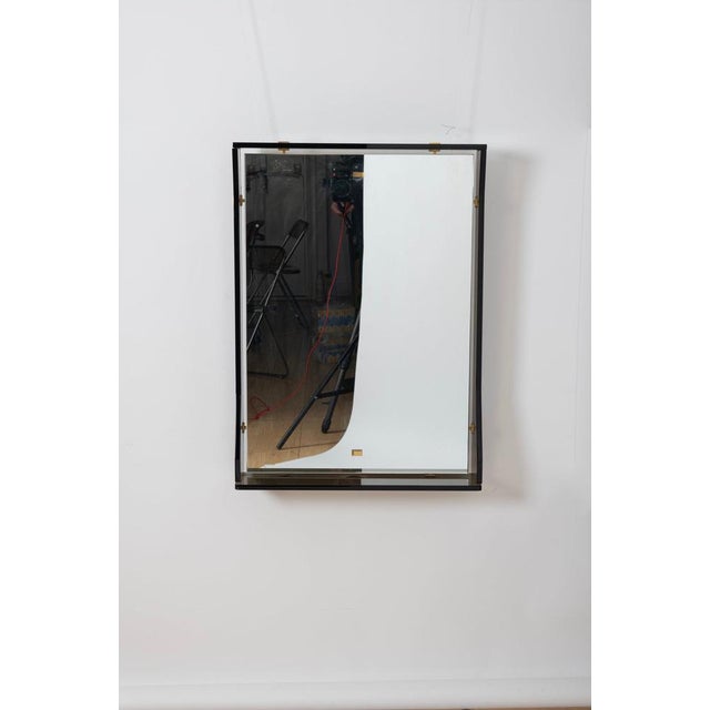 Nice mirror with grey/green frame. Brass details. In the style of Fontana Arte. Italy, 1970s.