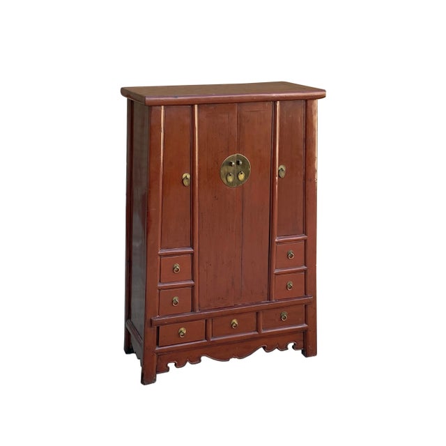 Discover the charm of yesteryears with this captivating vintage Chinese accent storage cabinet. Its weathered brick-red...