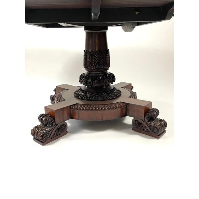 A fine quality, generously proportioned William IV rosewood center or dining table, the round top showcasing the...