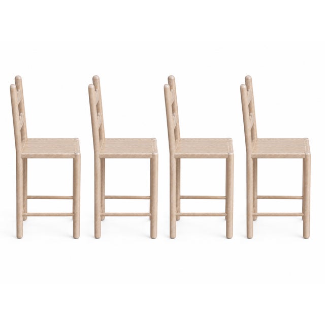 Set of 4 country French solid oak counter stools. Stools are done in a rich Antique Cerused oak finish by our shop The...