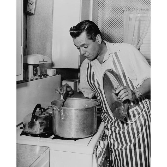 Desi In The Kitchen American actor and musician Desi Arnaz (1917 - 1986) stirring a large pot in the kitchen, circa 1955....