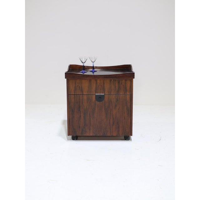 Prepare and serve your drinks in style with this compact bar cabinet from denmark, 1960s. This mid-century bar cart /...
