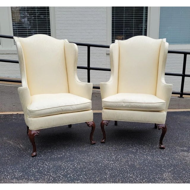 A refined pair of Queen Anne style wingback chairs by Southwood Furniture, long regarded among America’s premier makers of...