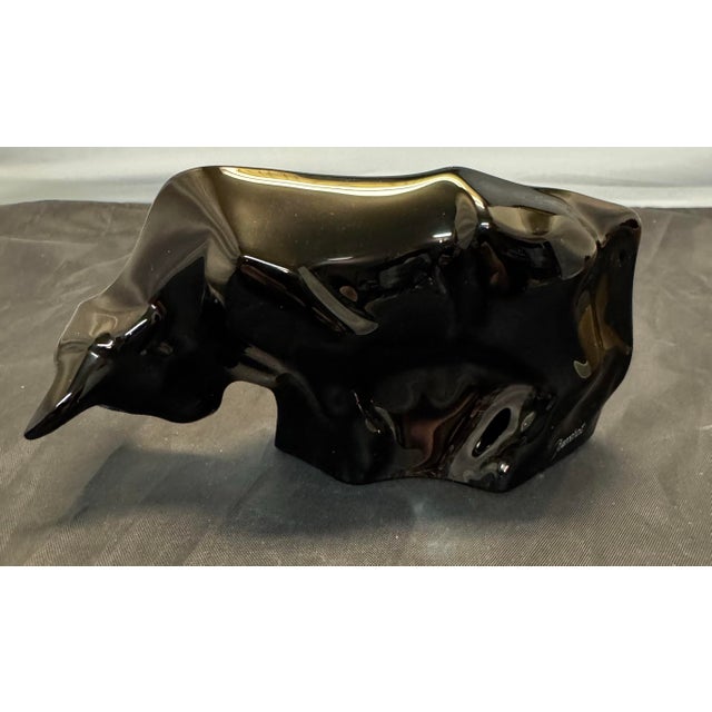 The Baccarat Black Bull Figurine is a vintage crystal figurine from France, standing at 6.5 inches tall. This exquisite...