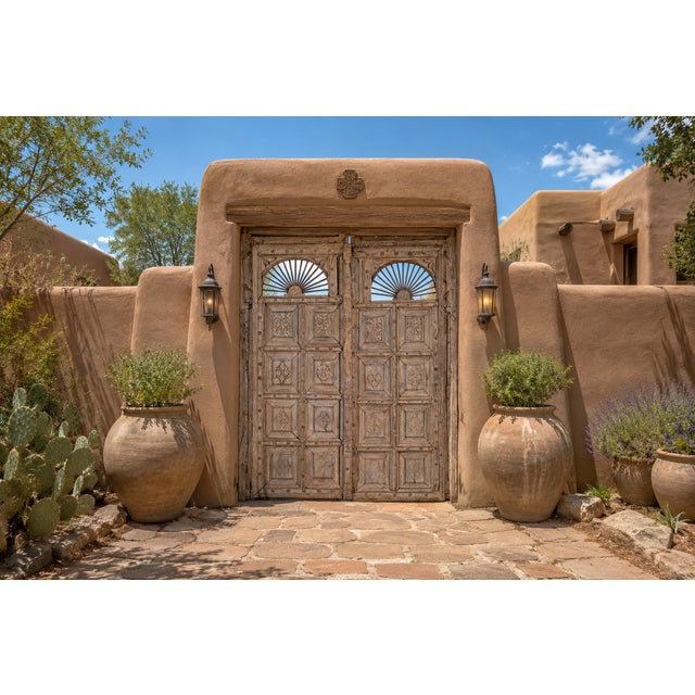 This Antique Indian Carved and Bleached Teakwood Large Door is an impressive architectural statement piece, handcrafted...