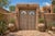 This Antique Indian Carved and Bleached Teakwood Large Door is an impressive architectural statement piece, handcrafted...
