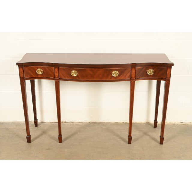 A gorgeous Federal or Hepplewhite style serpentine front console table By Baker Furniture, "Historic Charleston"...