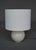 A nice lampbase by Belgium ceramicist Roger Guerin in a bulbous shape with a suble drip glaze in shades of grey and light...