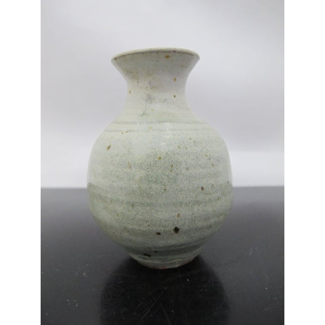 Chinese Longquan Celadon glazed pottery vase. Originated in the Longquan region of Zhejiang province. Measures 3 3/4" tall...