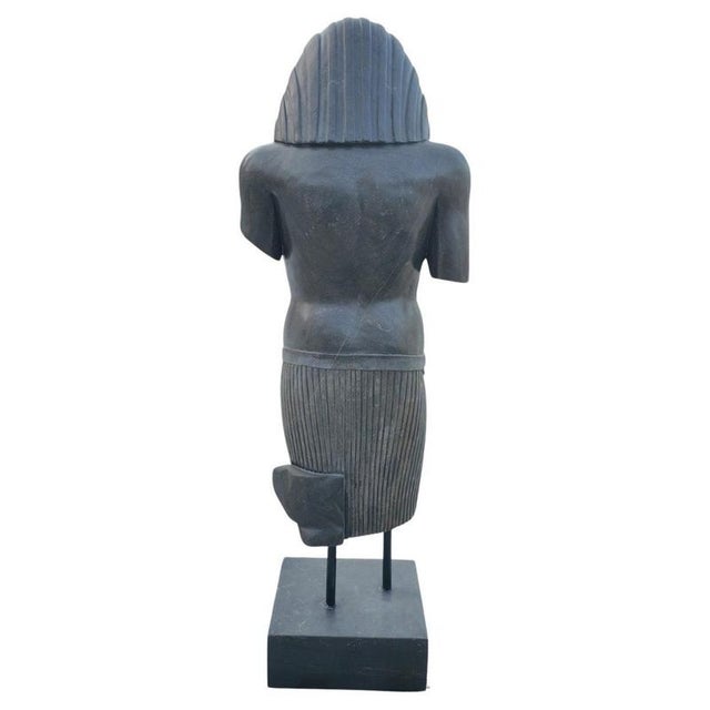 A striking solid marble sculpture inspired by ancient Egyptian artistry, exuding elegance and timeless sophistication. The...