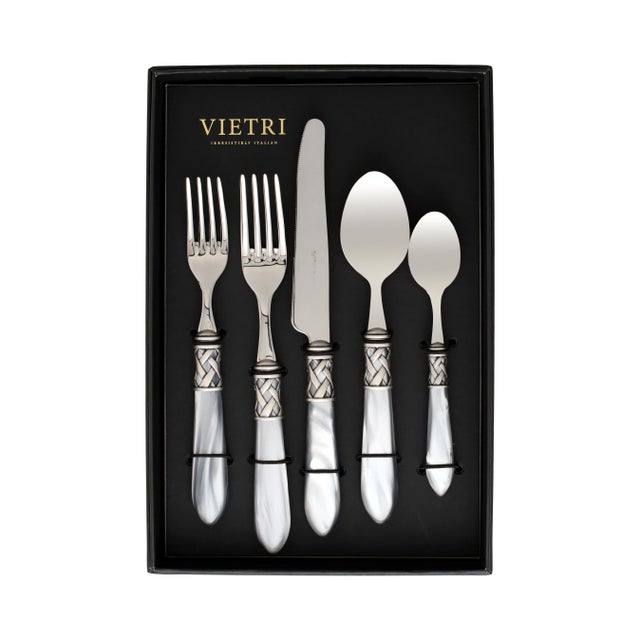 The Aladdin Antique Flatware Five-Piece Place Setting - service for one guest - features elegant pearlized handles with...