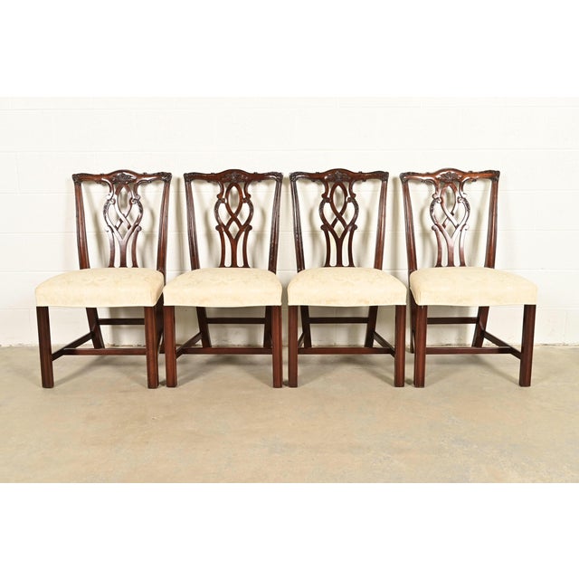 A gorgeous set of four Georgian or Chippendale style dining chairs By Kindel Furniture USA, 1988 Solid carved mahogany...