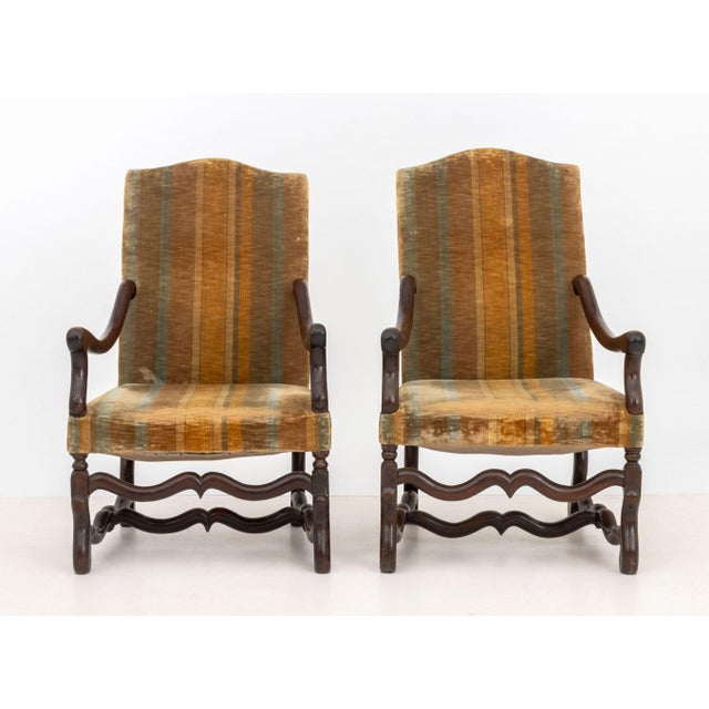 Pair of Louis XIII Walnut Fauteuils, 17th century, with striped velvet upholstery. 41" H x 25.25" W x 33" D; seat: 17" H....