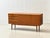 A generously proportioned sideboard from the 1960s, crafted from high-quality teak. The clean, horizontally structured...
