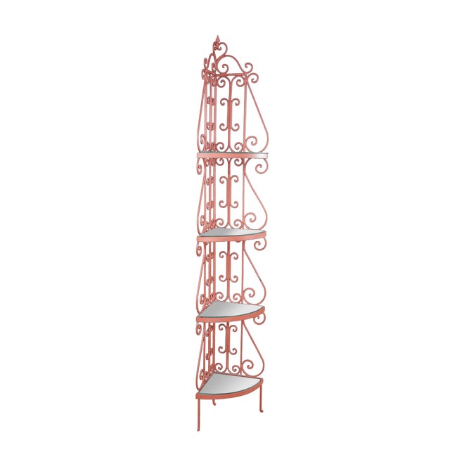 This vintage French-style corner bakers rack features an ornate, four-tier openwork frame crafted from scrolled wrought...