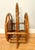 This rattan and woven cane magazine rack/book holder, which dates to the 1960s/1970s, is in excellent vintage condition....