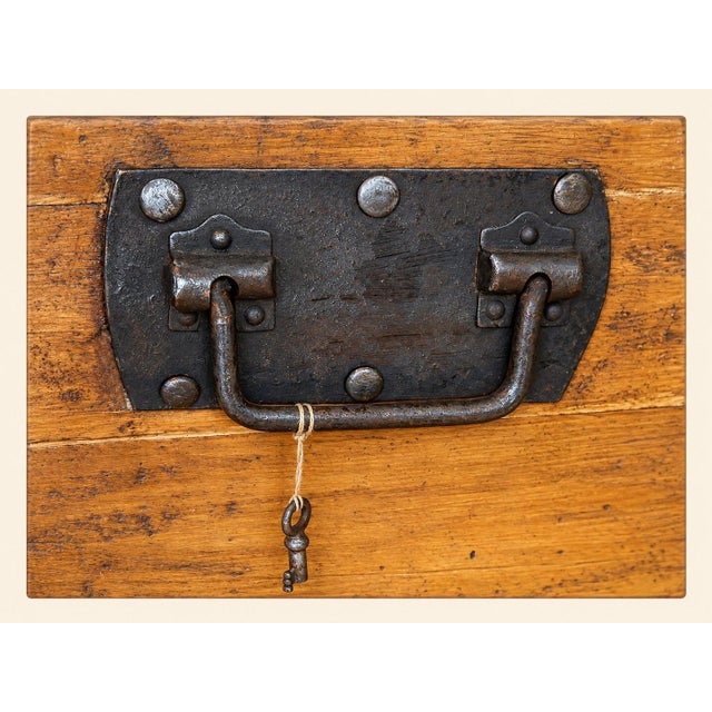 A travel trunk with a domed lid, dating from the second half of the 19th century. The frame is made of light wood...