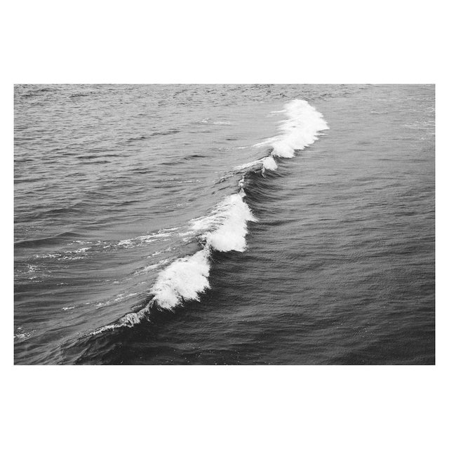 A wave crest breaks along the Pacific ocean. Captured in high contrast black and white and printed¬†on archival 100%...