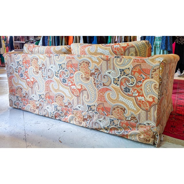 Fun orange print loveseat in the manner of Jack Larsen in a paisley print with 4 matching accent pillows. Made by...