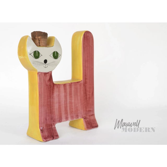 A very rare and gorgeous mid century modern Italian ceramic cat jar with a cork stopper. Hand-painted in red, orange...