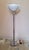 Beautiful designer floor lamp, designed by Gae Aulenti for Harvey Guzzini in the early seventies. The circular base and...