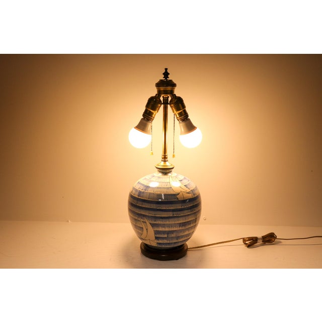 This vintage studio art pottery lamp brings the serenity of the seaside into your home. Decorated with hand-crafted blue...