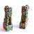A petite pair of foo dogs on plinths, modelled in a rustic and quite charming manner: tool marks and cuts in the clay are...