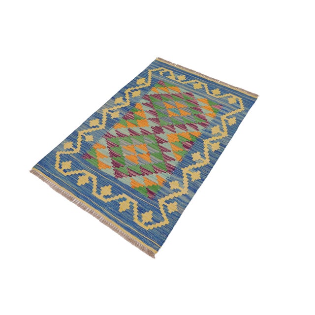 Elevate the elegance of your home with this stunning hand-woven tribal Kilim wool rug. Meticulously crafted on a loom by...